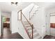 Bright foyer showcasing hardwood floors, staircase and classic moldings at 2731 Old Coach Rd, Duluth, GA 30096