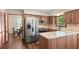Kitchen features stainless steel appliances, granite countertops, and wood cabinets at 2731 Old Coach Rd, Duluth, GA 30096