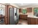 Kitchen features modern appliances, wood cabinets, and granite countertops at 2731 Old Coach Rd, Duluth, GA 30096
