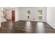 Open-concept living area with hardwood floors, natural light, and a welcoming ambiance at 2731 Old Coach Rd, Duluth, GA 30096