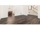 Bright living room with hardwood floors, white walls, and a staircase at 2731 Old Coach Rd, Duluth, GA 30096