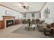 Cozy living room features a fireplace, wood trim and neutral furniture at 2731 Old Coach Rd, Duluth, GA 30096
