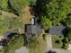 Aerial view of home and treed yard with neighboring houses at 8876 Ashwood Dr, Riverdale, GA 30274