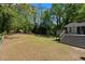 View of a deck looking out to the backyard and trees at 8876 Ashwood Dr, Riverdale, GA 30274
