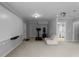 Basement area with neutral walls and carpet, and a designated workout area with exercise equipment at 8876 Ashwood Dr, Riverdale, GA 30274