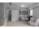 Finished basement featuring neutral walls and carpet with access to the staircase at 8876 Ashwood Dr, Riverdale, GA 30274