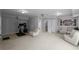 Finished basement area featuring neutral walls and carpet with a designated space for workout equipment at 8876 Ashwood Dr, Riverdale, GA 30274
