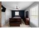 Bedroom featuring dark wood furniture, neutral paint and contemporary ceiling fan at 8876 Ashwood Dr, Riverdale, GA 30274