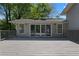 Spacious wooden deck with sliding glass doors leading to the home, ideal for entertaining guests at 8876 Ashwood Dr, Riverdale, GA 30274