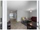 A view of the living room from the foyer has tile floors and decor at 8876 Ashwood Dr, Riverdale, GA 30274