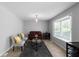 Cozy living room featuring a bay window, modern furniture, and neutral decor for relaxed living at 8876 Ashwood Dr, Riverdale, GA 30274