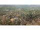 Aerial shot of house sitting among dense trees at 998 Sisley Trl, White, GA 30184