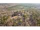 Aerial view of house surrounded by lush mature trees at 998 Sisley Trl, White, GA 30184