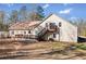 A view of the house from the backyard with a spacious lot and trees at 998 Sisley Trl, White, GA 30184