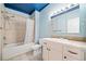 Bathroom with tile surround shower, vanity, and creative constellation ceiling at 998 Sisley Trl, White, GA 30184