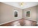 Bright bedroom with wood flooring, large windows, and a cozy, neutral color scheme at 998 Sisley Trl, White, GA 30184