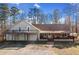 Charming home with a spacious front porch, upper deck, and a welcoming facade at 998 Sisley Trl, White, GA 30184