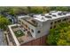 Apartment building featuring multiple rooftop terraces with outdoor seating and grilling areas at 112 Rogers Ne St # 503, Atlanta, GA 30317