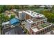 An aerial view of the building showcasing the rooftop area, surrounding landscape, and nearby field at 112 Rogers Ne St # 503, Atlanta, GA 30317
