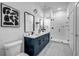 Modern bathroom with double sinks, sleek fixtures, and a glass-enclosed shower at 112 Rogers Ne St # 503, Atlanta, GA 30317
