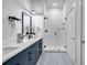 Sleek bathroom with a glass-enclosed shower, modern vanity, stylish fixtures, and plenty of storage space at 112 Rogers Ne St # 503, Atlanta, GA 30317