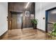 Elevator lobby with modern design elements, wood accents, and decorative artwork at 112 Rogers Ne St # 503, Atlanta, GA 30317