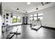 Well-equipped gym with various machines and weights, brightened by large windows at 112 Rogers Ne St # 503, Atlanta, GA 30317