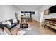 Spacious open-concept living room with modern furnishings and stylish decor, seamlessly flowing into the kitchen at 112 Rogers Ne St # 503, Atlanta, GA 30317