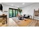 Bright living room with modern decor, balcony access, and stylish furnishings, perfect for relaxing or entertaining guests at 112 Rogers Ne St # 503, Atlanta, GA 30317