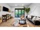Cozy living room featuring modern decor, a balcony, and lots of natural light at 112 Rogers Ne St # 503, Atlanta, GA 30317