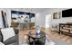 Open-concept kitchen and living room with bar seating and natural light at 112 Rogers Ne St # 503, Atlanta, GA 30317