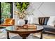 Beautiful living room with stylish furnishings, including a leather sofa, accent chair, and decorative coffee table at 112 Rogers Ne St # 503, Atlanta, GA 30317