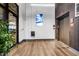 Modern lobby with wood floors, an elevator, and a decorative plant near the entrance at 112 Rogers Ne St # 503, Atlanta, GA 30317