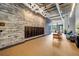 Modern lobby with package storage, seating, exposed ceilings, brick accents, and contemporary lighting at 112 Rogers Ne St # 503, Atlanta, GA 30317