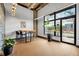 Bright office space with a conference table, large window, and exposed ceilings and ductwork at 112 Rogers Ne St # 503, Atlanta, GA 30317