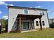 Back of house featuring wood pergola shading a patio and grassy backyard at 1151 Wisteria Sw Dr, Mableton, GA 30126