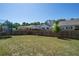 Spacious, well-maintained backyard featuring green grass, a fence, and a trampoline at 1151 Wisteria Sw Dr, Mableton, GA 30126
