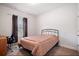 Cozy bedroom featuring carpet flooring, a comfortable bed, and a window with curtains at 1151 Wisteria Sw Dr, Mableton, GA 30126