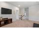 Spacious bonus room with a TV, console, and staircase access to other parts of the home at 1151 Wisteria Sw Dr, Mableton, GA 30126