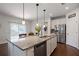 Spacious kitchen featuring granite countertops, stainless steel appliances, and a central island at 1151 Wisteria Sw Dr, Mableton, GA 30126