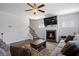 Cozy living room featuring a fireplace, hardwood floors, and comfortable seating at 1151 Wisteria Sw Dr, Mableton, GA 30126