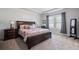 This main bedroom offers a spacious layout, natural light, and a tray ceiling, creating a comfortable retreat at 1151 Wisteria Sw Dr, Mableton, GA 30126