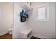 This well-lit mudroom features a convenient bench, storage cubbies, hooks, and a shelf for easy organization at 1151 Wisteria Sw Dr, Mableton, GA 30126