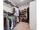A well-organized walk-in closet with ample hanging space, shelving, and storage options at 1151 Wisteria Sw Dr, Mableton, GA 30126