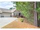 A charming single-Gathering home with a spacious driveway and lush surrounding greenery at 2417 Tree Arbor Way, Marietta, GA 30064