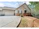 Inviting home exterior showcasing a two-car garage, charming entrance, and a cozy front yard at 2417 Tree Arbor Way, Marietta, GA 30064
