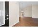 Bright, open-concept living room features hardwood floors, a vaulted ceiling, and neutral paint at 2417 Tree Arbor Way, Marietta, GA 30064