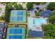 Aerial view of community pool, parking, tennis courts, and clubhouse at 5210 Davenport Pl, Roswell, GA 30075