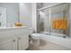 Well-lit bathroom with a shower, a toilet and a modern vanity at 5210 Davenport Pl, Roswell, GA 30075