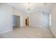 Bright bedroom with neutral walls and wood floors and access to the bathroom at 5210 Davenport Pl, Roswell, GA 30075